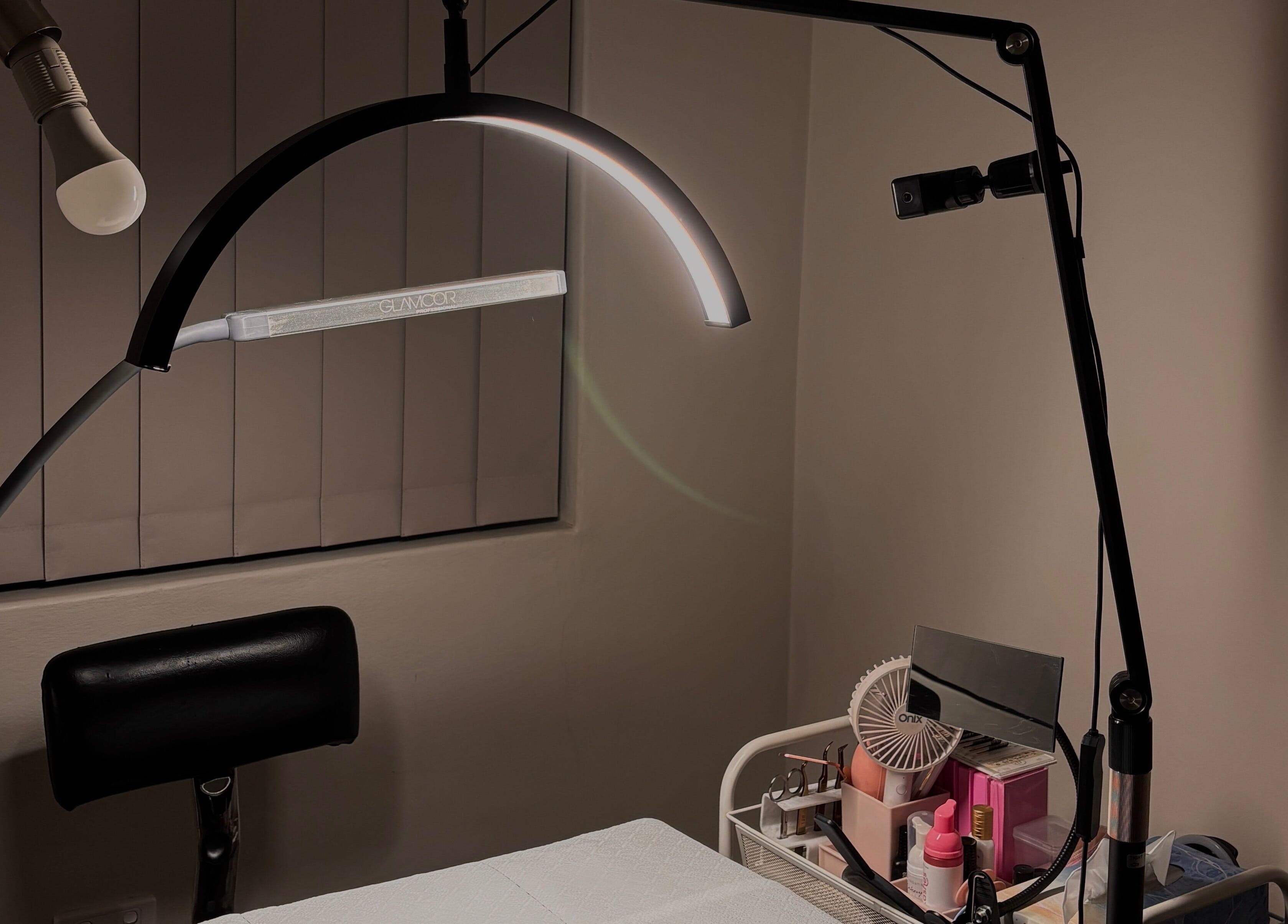 Professional lash setup at IC Lashes, Balgownie, New South Wales, AU, showcasing tools and ambient lighting.