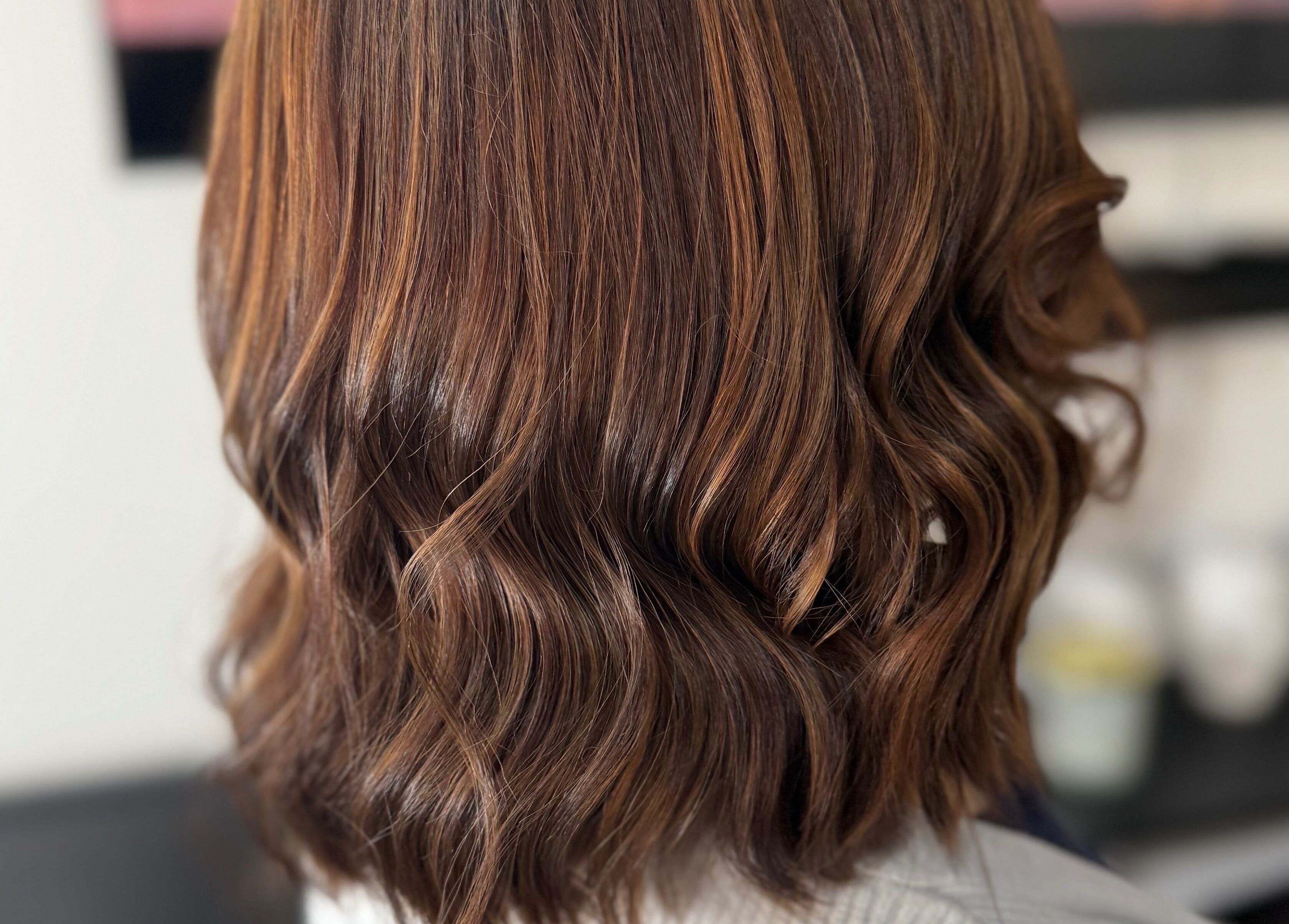 Elegant wavy hairstyle at Dollie's Hair Lounge, Rabat, MT.