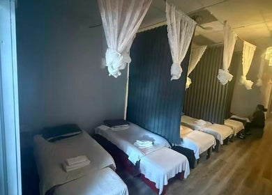 Tranquil massage beds at Chi Foot Spa in Pembroke Pines, Florida, US, showcasing a serene wellness setting.