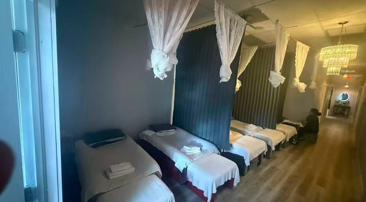 Tranquil massage beds at Chi Foot Spa in Pembroke Pines, Florida, US, showcasing a serene wellness setting.