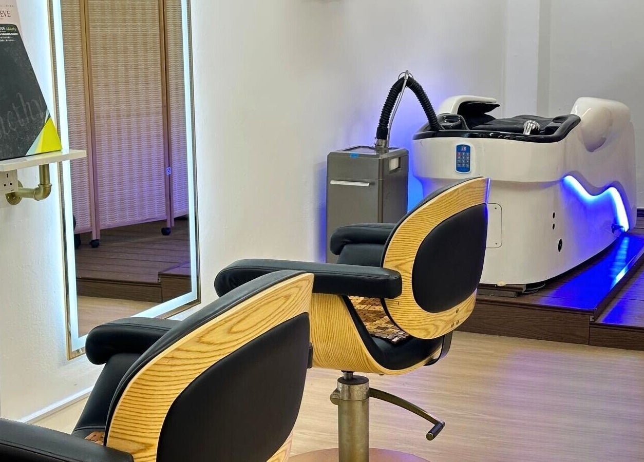 Elegant salon chairs and modern hair washing station at The Hive Salon, Singapore, Singapore, SG.