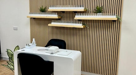 Chic nail station at Kindred Hair & Beauty, Brighton And Hove, England, GB with sleek design and product shelves.