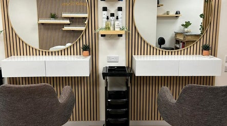 Modern salon setup at Kindred Hair & Beauty in Brighton And Hove, England, GB, featuring chic mirrors and chairs.