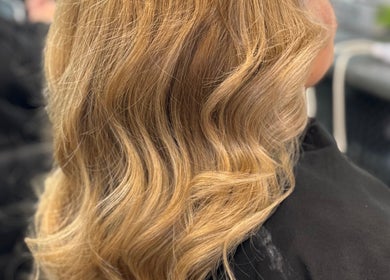 Styled blonde waves at SAMBELLEZAHAIR, Penrith, New South Wales, AU, showcasing expert styling craftsmanship.