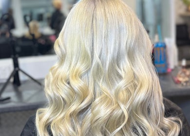 Elegant blonde waves styled at SAMBELLEZAHAIR in Penrith, New South Wales, AU, showcasing salon expertise.