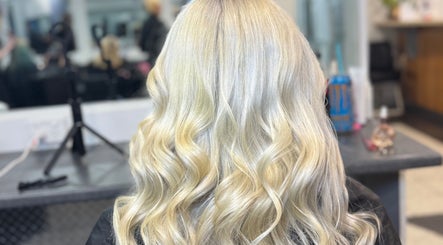 Elegant blonde waves styled at SAMBELLEZAHAIR in Penrith, New South Wales, AU, showcasing salon expertise.
