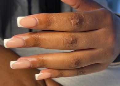 French manicure on hand at LNK Beauty Salon, Windhoek, Khomas Region, NA, showcasing elegant nail design.