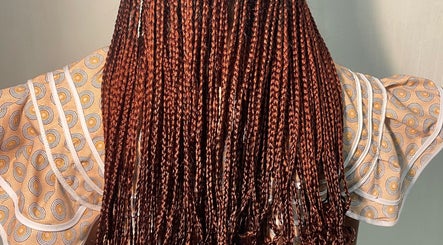 Detailed view of crimson braids at LNK Beauty Salon, Windhoek, Khomas Region, NA.