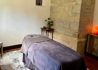 Massage table in a serene room at The Serenity Lodge, Long Marston, England, GB.
