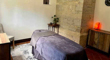 Massage table in a serene room at The Serenity Lodge, Long Marston, England, GB.