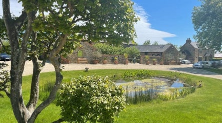 Scenic view of The Sanctuary at Upper Farm with lush greenery in Tiffield, England, GB.