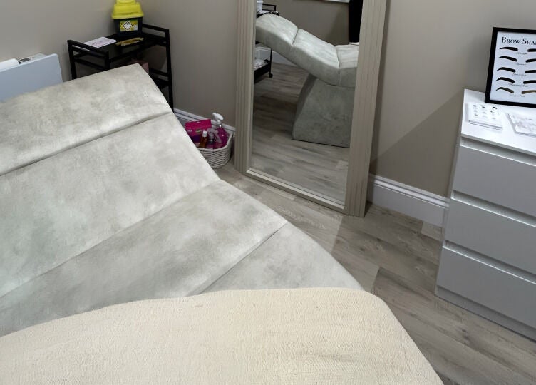 Cozy treatment room at keishalilly aesthetics, Gainsborough, England, GB with a plush bed and soothing decor.