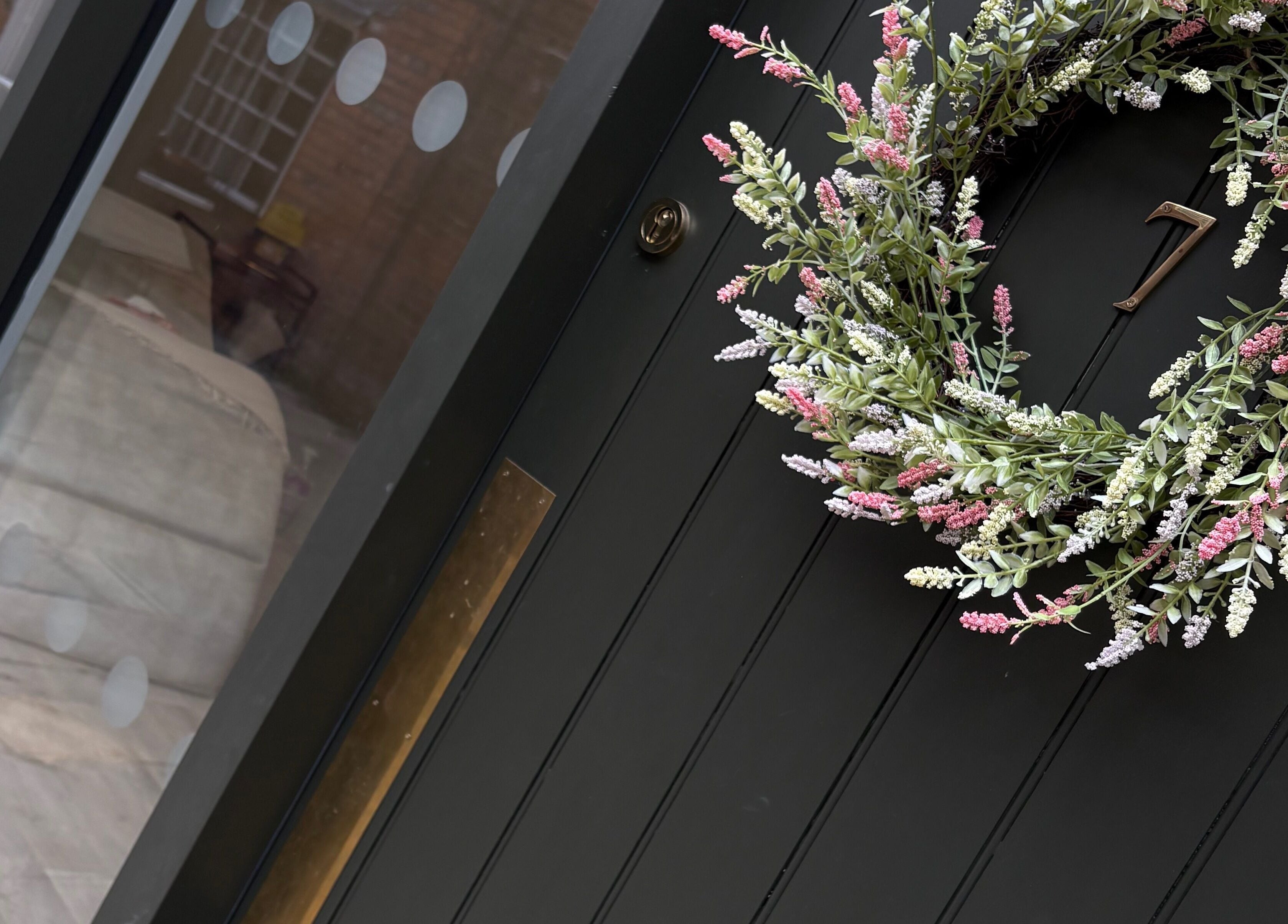 Elegant entrance of Keishalilly Aesthetics in Gainsborough, England with floral wreath.