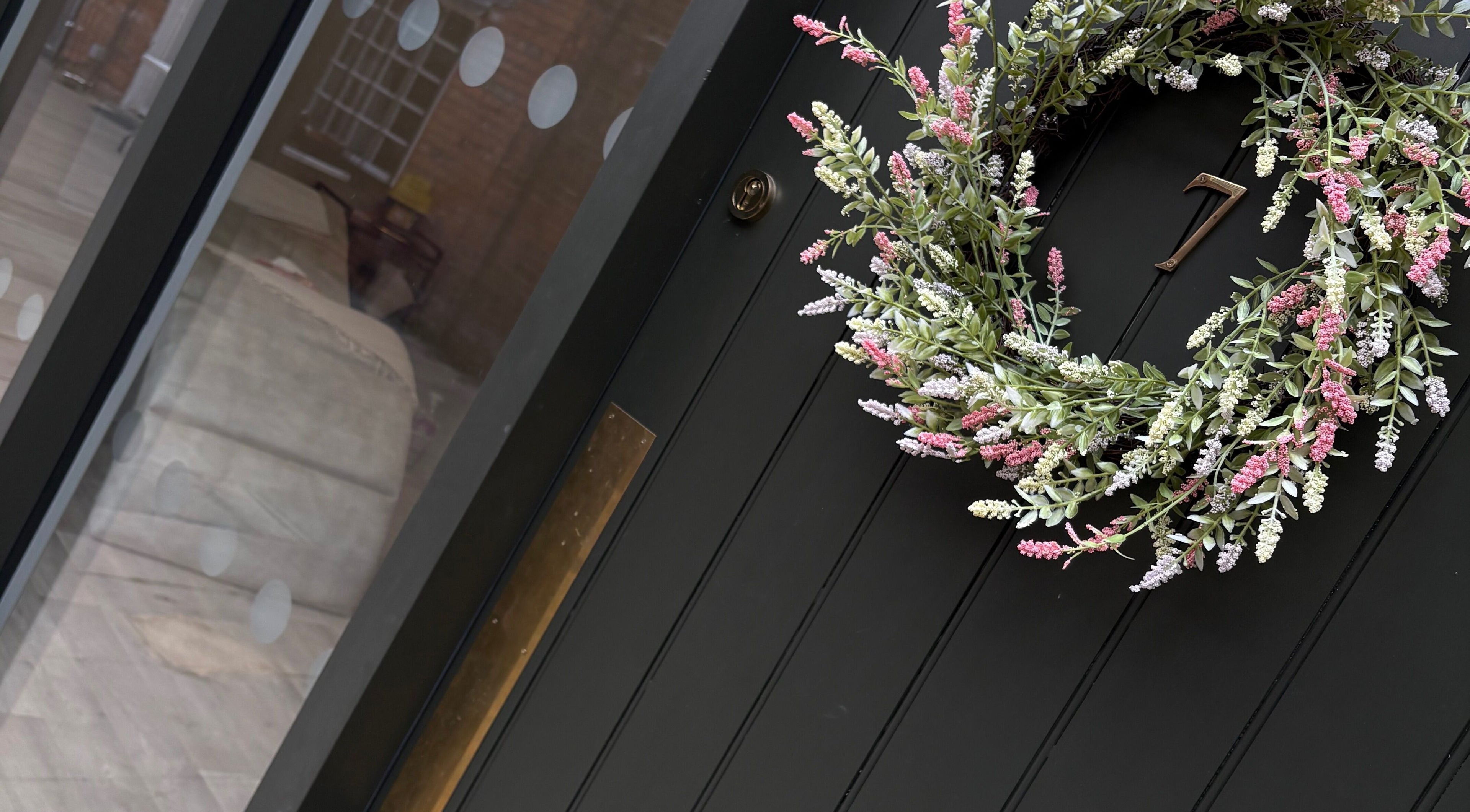Elegant entrance of Keishalilly Aesthetics in Gainsborough, England with floral wreath.