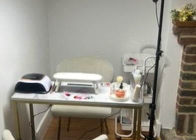 Cozy nail station at Hollie’s Beauty Room, Eastbourne, England, GB with manicure tools and cozy decor.
