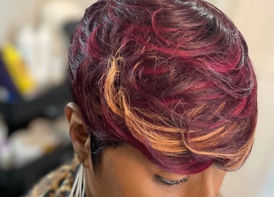 Close-up of vibrant hairstyle at Just Breathe, Atlanta, Georgia, US showcasing rich colors and modern technique.