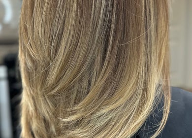 Close-up of sleek layered haircut at Celebrity Hairstylist, Toronto, Ontario, CA.