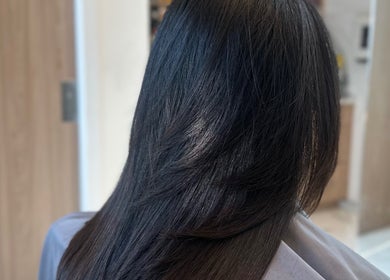 Expertly styled smooth hair at Celebrity Hairstylist, Toronto, Ontario, CA, showcasing professional craftsmanship.