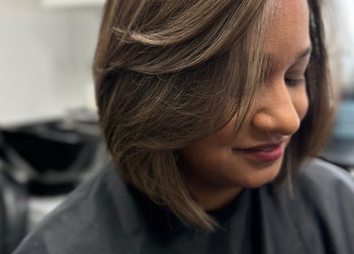 Close-up of a woman with chic haircut at Celebrity Hairstylist, Toronto, Ontario, CA.