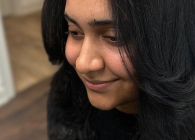 Woman with sleek, black hair styled at Celebrity Hairstylist in Toronto, Ontario, CA.