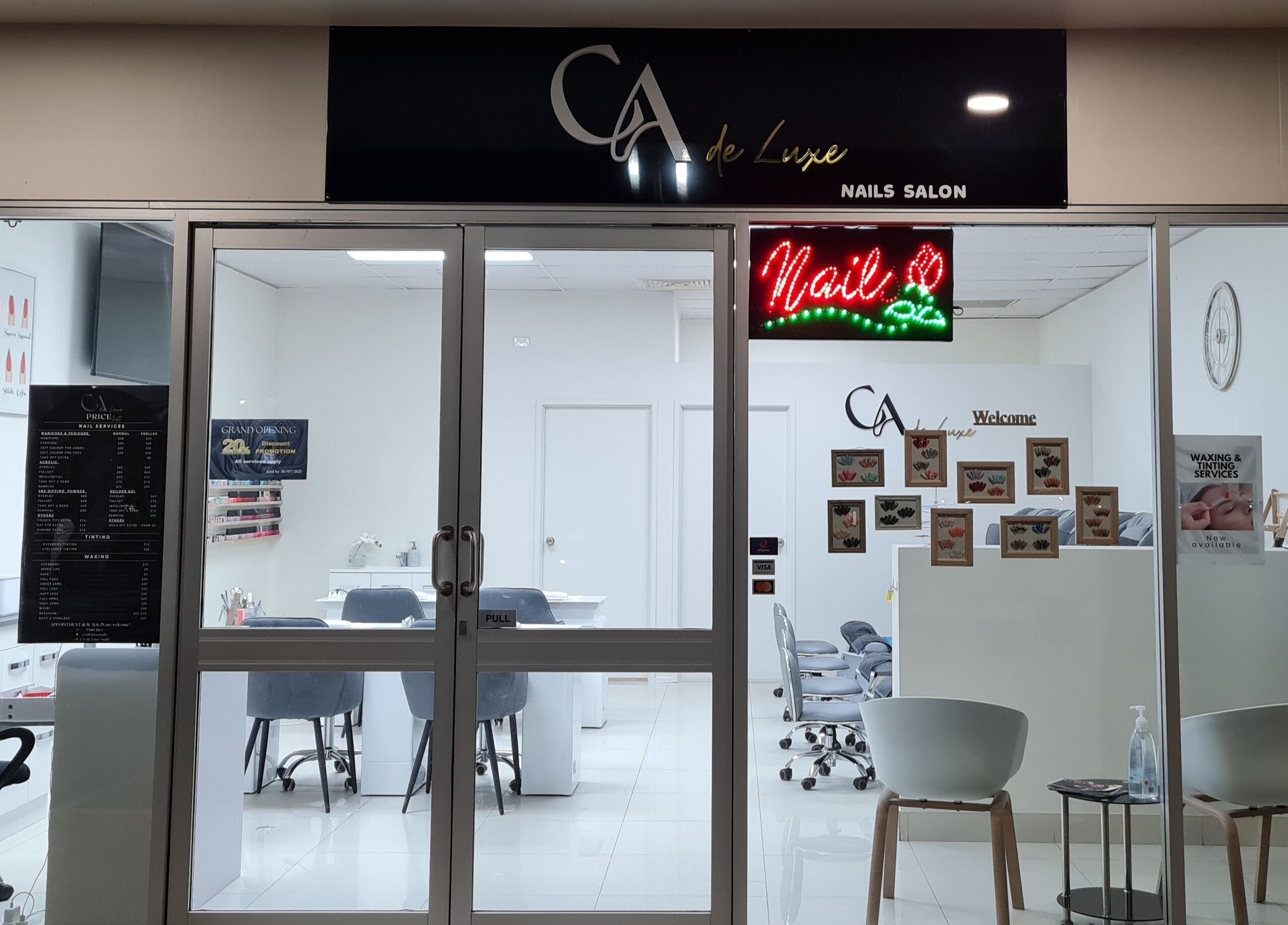 Exterior view of CA de Luxe Nails salon in Oxenford, Queensland, AU, showcasing modern and inviting ambiance.