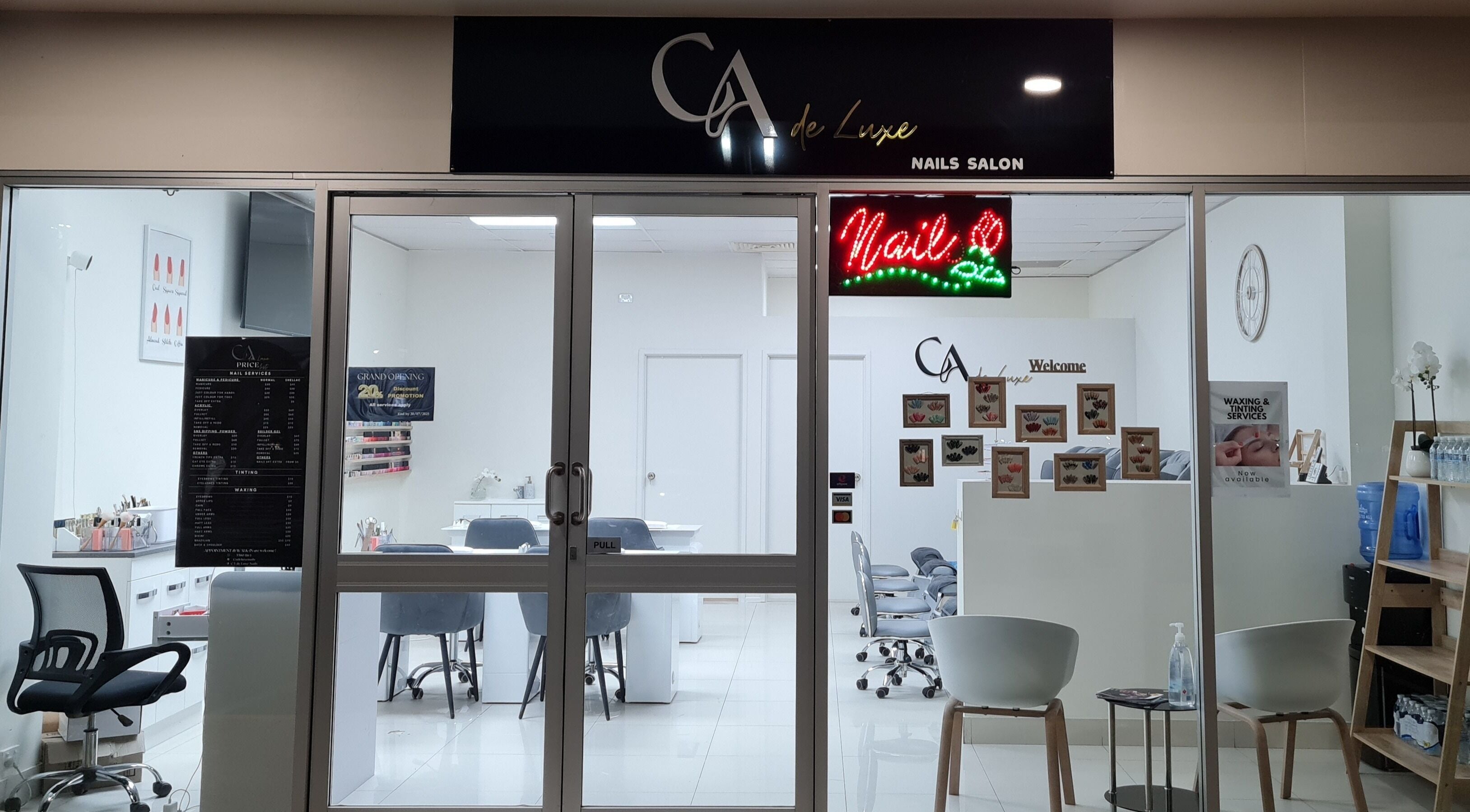 Exterior view of CA de Luxe Nails salon in Oxenford, Queensland, AU, showcasing modern and inviting ambiance.