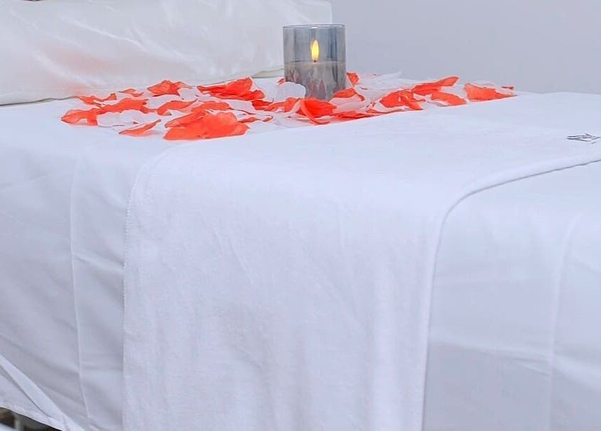 Luxurious spa bed with petals and candle at J&M SPA KENYA, Mombasa, Mombasa County, KE.
