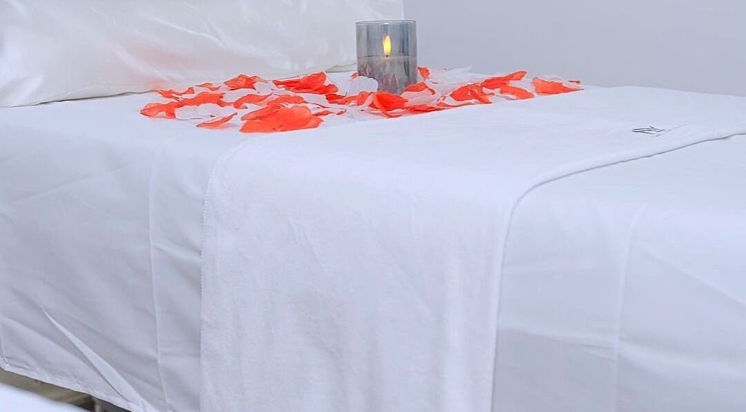 Luxurious spa bed with petals and candle at J&M SPA KENYA, Mombasa, Mombasa County, KE.