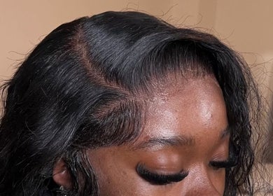 Close-up of sleek hairstyle created at Theseamlesslook, Buckingham, England, GB.
