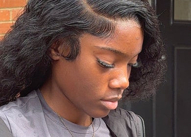 Elegant styled hair at Theseamlesslook in Buckingham, England, GB, showcasing intricate waves and sleek edges.