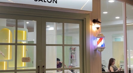 Exterior view of Stylistfai salon at Krung Thep Maha Nakhon with a welcoming open sign.