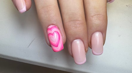 Pink heart nail art at Molly’s Nail Club, Birmingham, England, GB offering creative manicure designs.