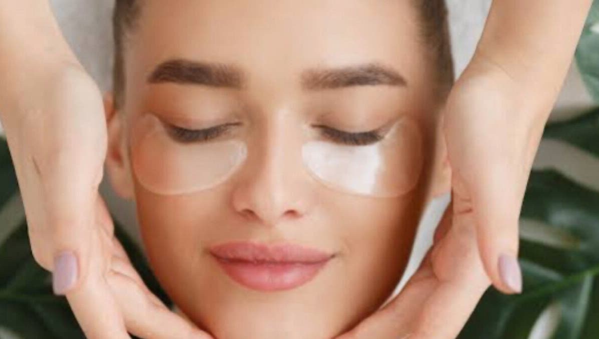 Woman enjoying a relaxing facial massage at TheClarkeComplextion, Plymouth, England, GB.