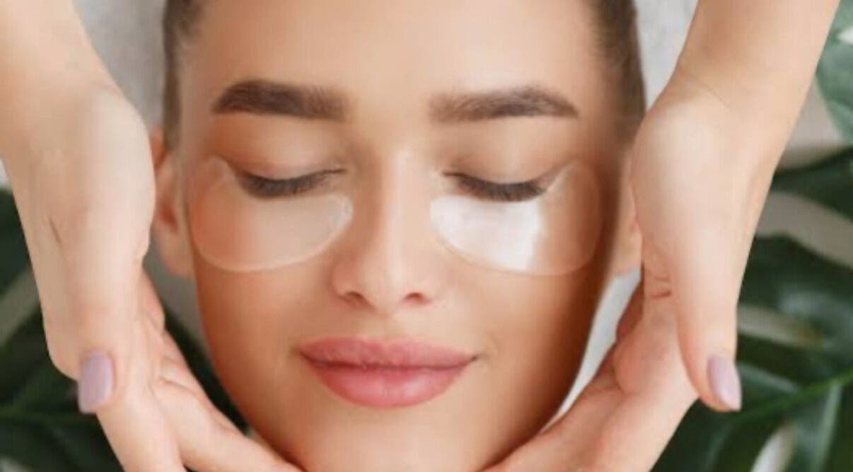 Woman enjoying a relaxing facial massage at TheClarkeComplextion, Plymouth, England, GB.