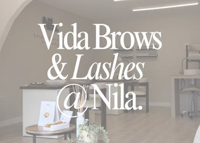 Chic interior of Vida Brows & Lashes, Hamilton, Scotland, GB showcasing elegant seating and decor.