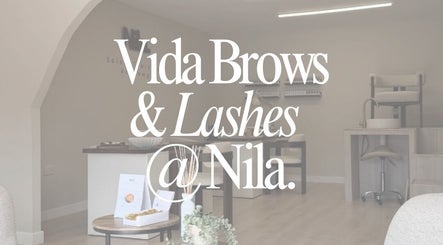 Chic interior of Vida Brows & Lashes, Hamilton, Scotland, GB showcasing elegant seating and decor.
