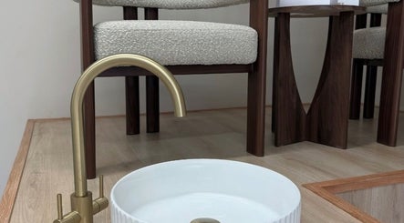 Elegant faucet and basin at Vida Brows & Lashes, Hamilton, Scotland, GB, embodying minimalist design.
