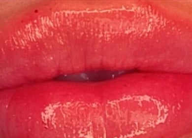 Glossy red lips beauty treatment at Rumours Aesthetics, Clonmel, County Tipperary, IE. Shine and allure enhanced.