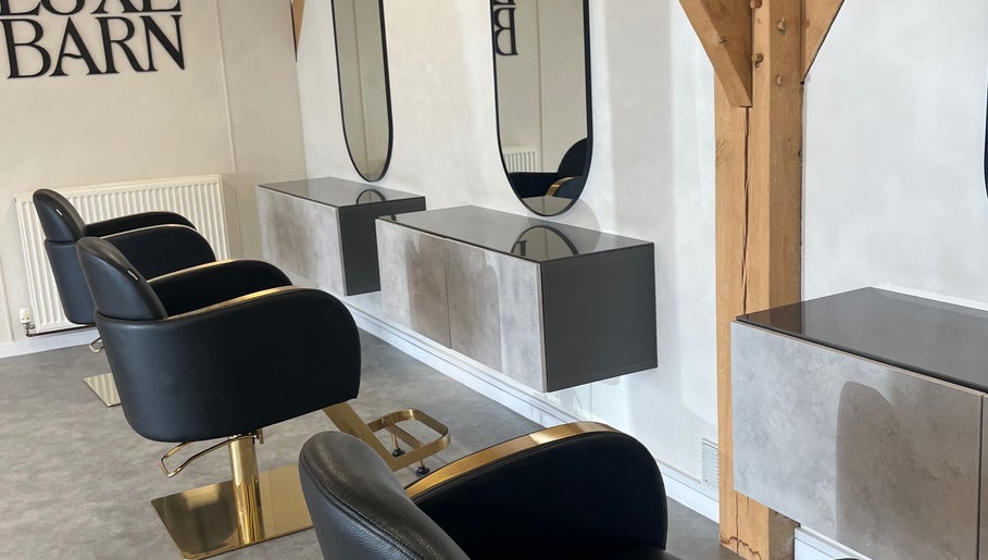 Modern salon chairs and mirrors at Meg Eliot Hair in Clevedon, England, GB.