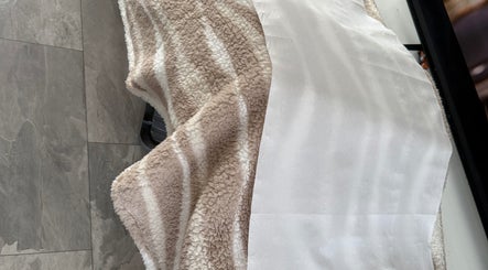 Soft, textured blanket on table at Lashesdunnebyh, Wishaw, Scotland, GB. Ideal for maximum comfort.