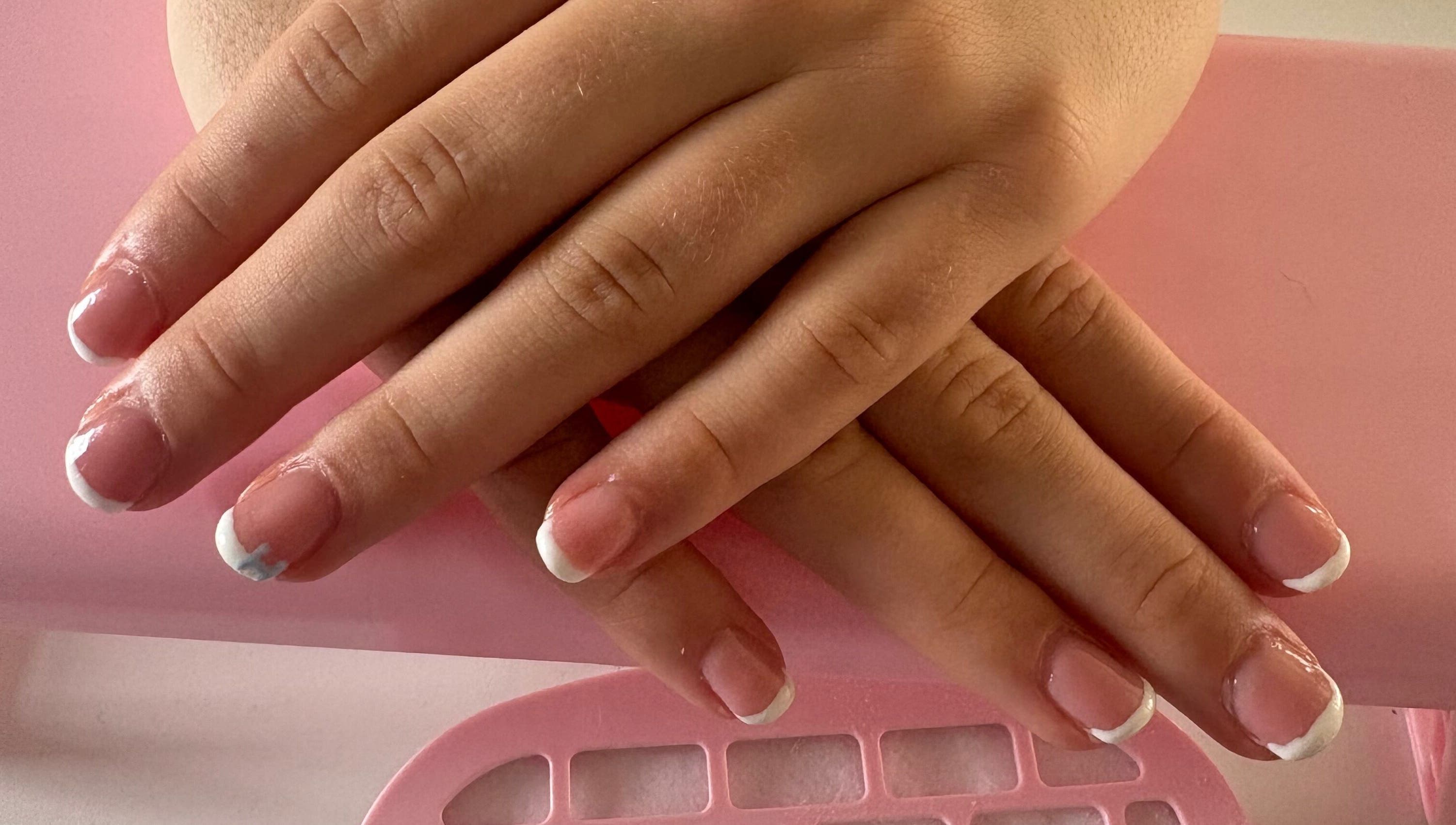 Elegant French manicure at CM Biab, Filton, England, GB, showcasing glossy, well-groomed nails.