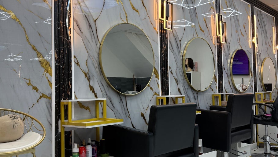 Elegant salon mirrors and chic seating at Rim’s Hairdressing in Sheffield, England, GB.