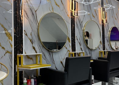 Elegant salon mirrors and chic seating at Rim’s Hairdressing in Sheffield, England, GB.