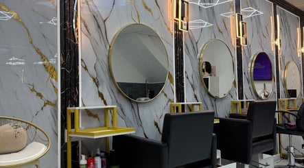Elegant salon mirrors and chic seating at Rim’s Hairdressing in Sheffield, England, GB.