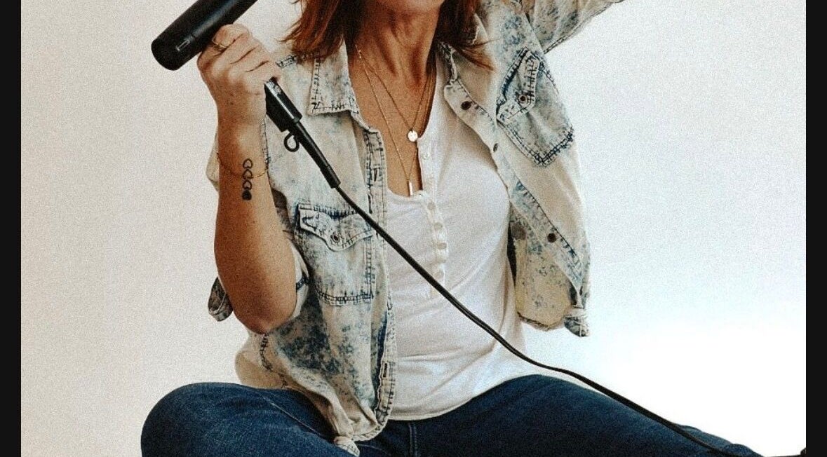 A stylist with a hair dryer at Beauty in A Bottle Aesthetics and Salon in Sherman, Texas, US.