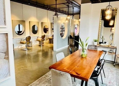 Hair by Sarah's stylish interior in Auckland, Auckland, NZ, showcasing modern design and comfortable seating.