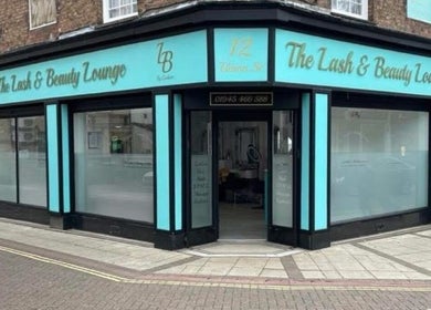 Exterior view of Beautyby_evie_x storefront in Wisbech, England, GB showcasing turquoise signage.