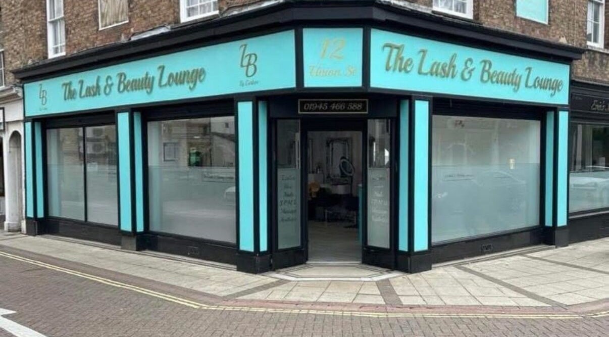 Exterior view of Beautyby_evie_x storefront in Wisbech, England, GB showcasing turquoise signage.