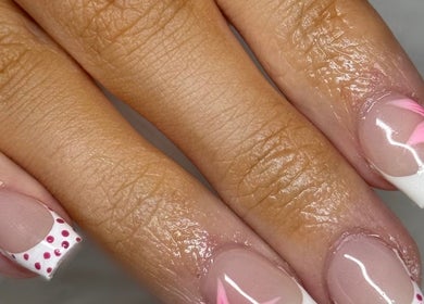 Elegant floral nail art at Beautyby_evie_x, Wisbech, England, GB, showcasing pink and white designs.