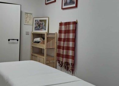 Calm massage room at Ottoman Novus Spa, Dublin, County Dublin, IE with a bed and relaxing decor.